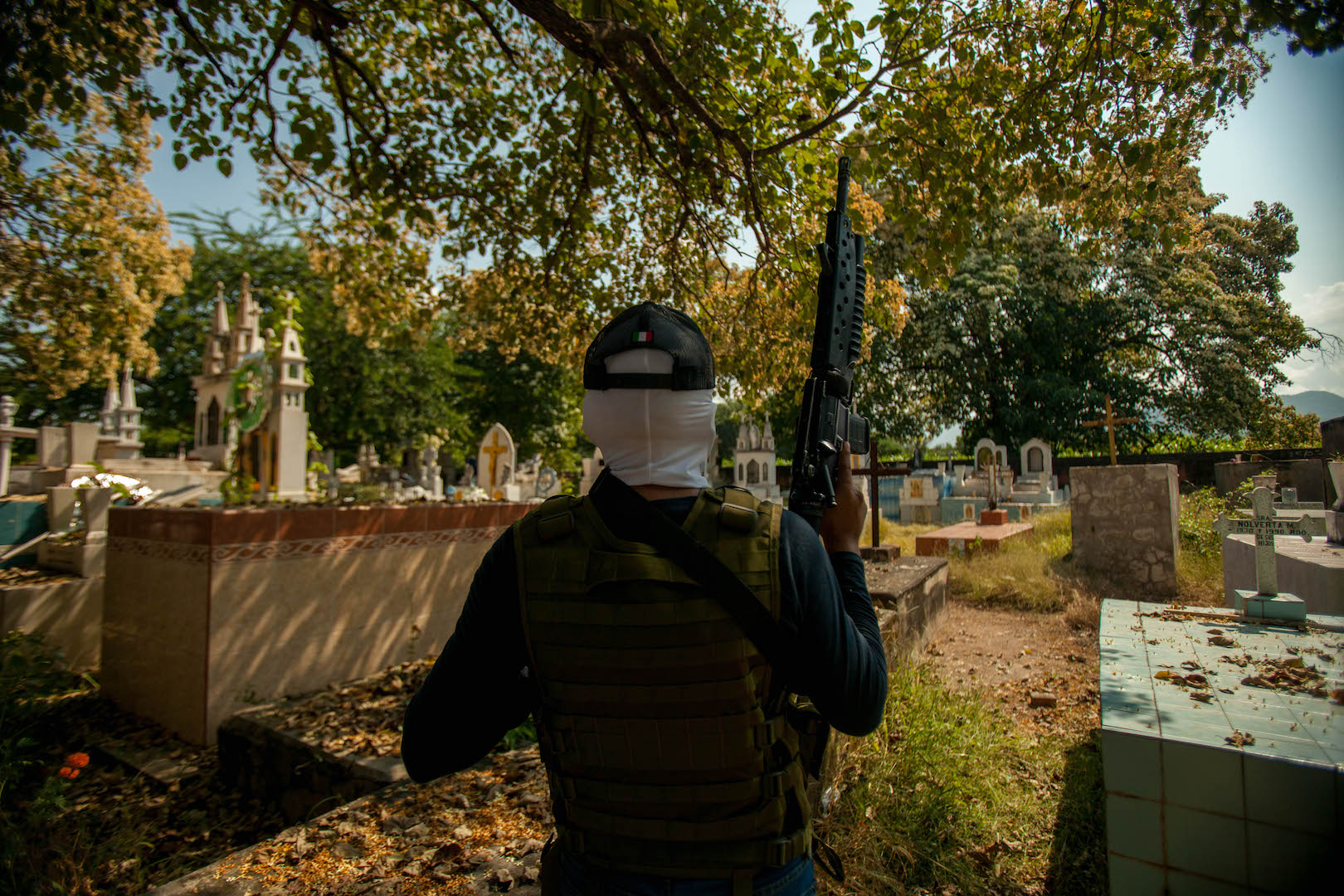 A Jalisco cartel member stands guard during the interview. Photo by Miguel Fernández-Flores.