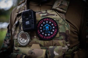 A man wears a "Three Percenter" patch as several hundred members of the Proud Boys and other similar groups gathered for a rally at Delta Park in Portland, Oregon on September 26, 2020 (Photo by Maranie R. STAAB / AFP) (Photo by MARANIE R. STAAB/AFP via G