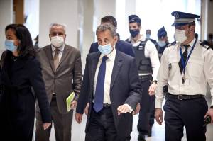 Former French President Nicolas Sarkozy arrives at court for the verdict of his trial for corruption and influence peddling in Paris on the 1st of March