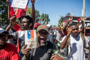 Demonstrators march in Port-au-Prince on February 10, 2021, to protest against the government of President Jovenel Moise.