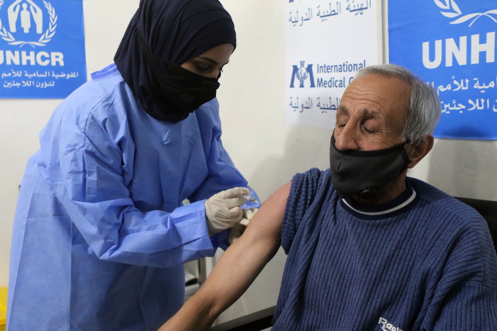 Syrian refugees receive free Jordanian government COVID-19 vaccines with a UNHCR facilitating process at the first worldwide Covid-19 vaccination centre in a refugees camp on February 16, 2021​.