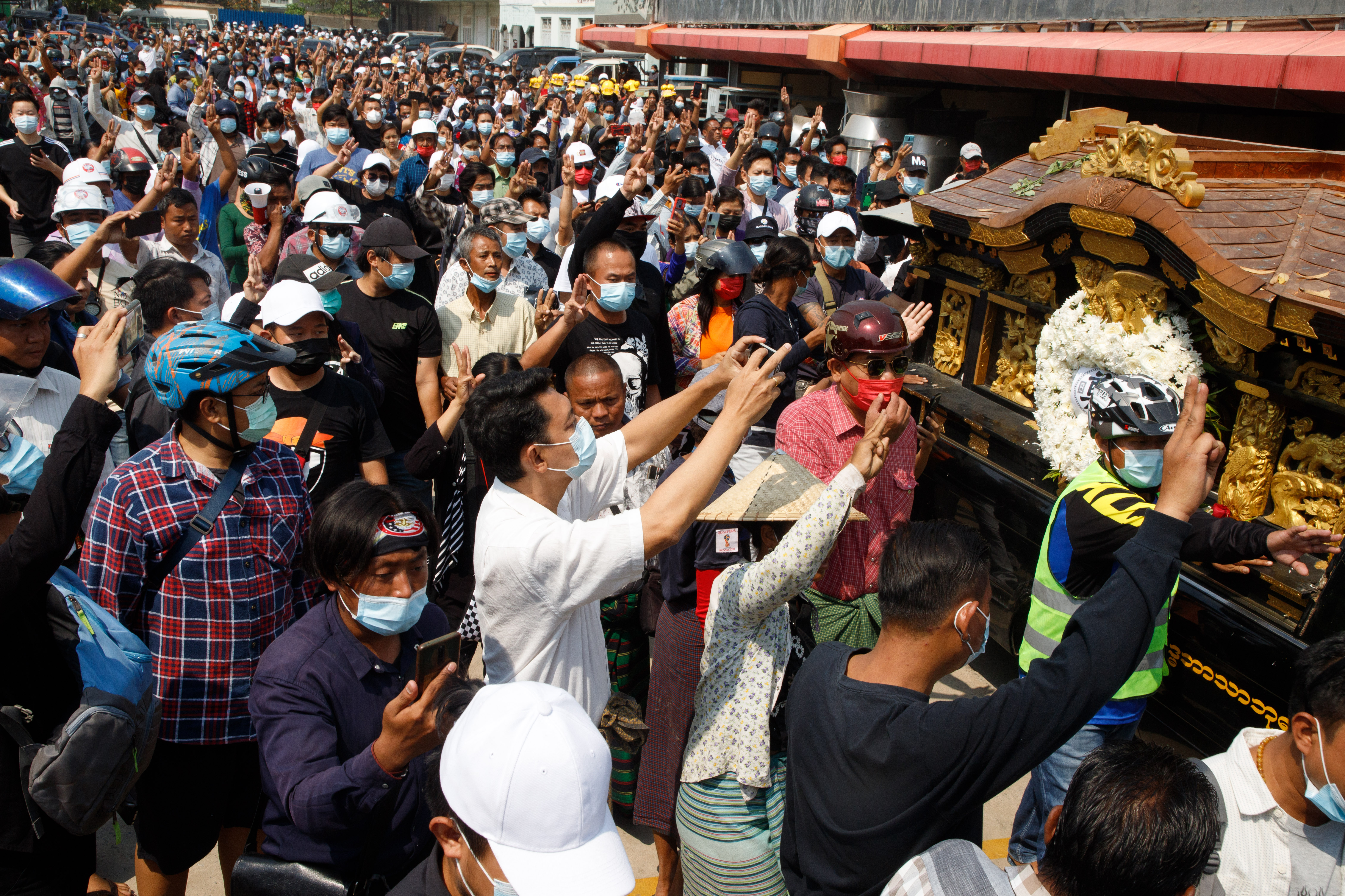 Crowds of supporters crowd around the hearse. PHOTO: STRINGER