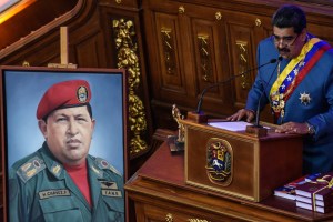 President Nicolás Maduro next to a photo of his predecessor, Hugo   Chávez.