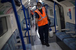 A TfL worker deep cleans a Victoria Line tube train at the London Underground. Photo by Kirsty O'Connor/PA Images via Getty Images