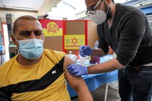 A Palestinian man who works in Israel receives a coronavirus vaccine in the occupied West Bank this month.