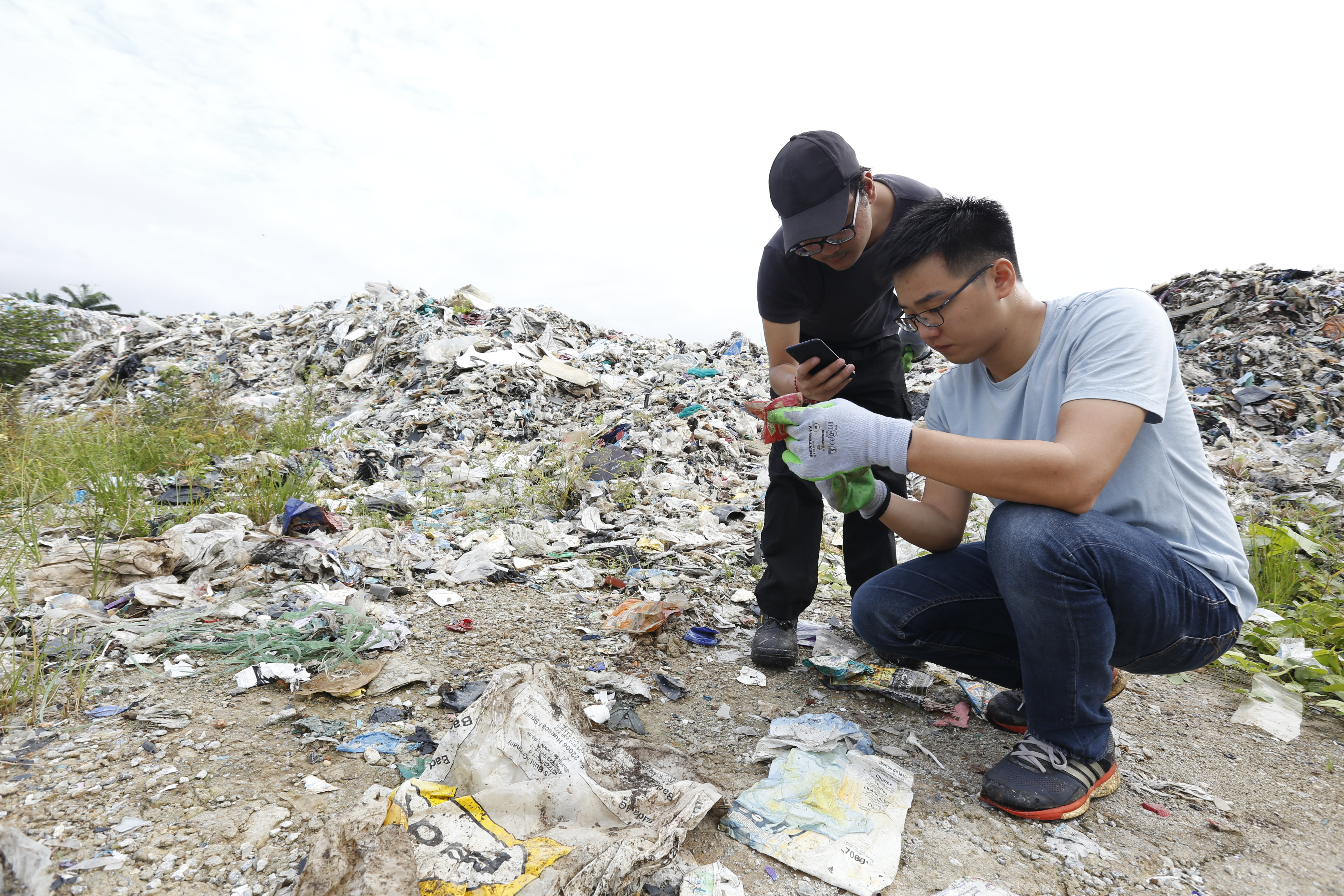 Heng inspects plastic waste near Port Klang, Malaysia 1 [Greenpeace Malaysia].JPG