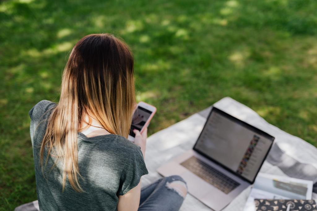 A teen on a phone and computer. Photo by Karolina Grabowska from Pexels