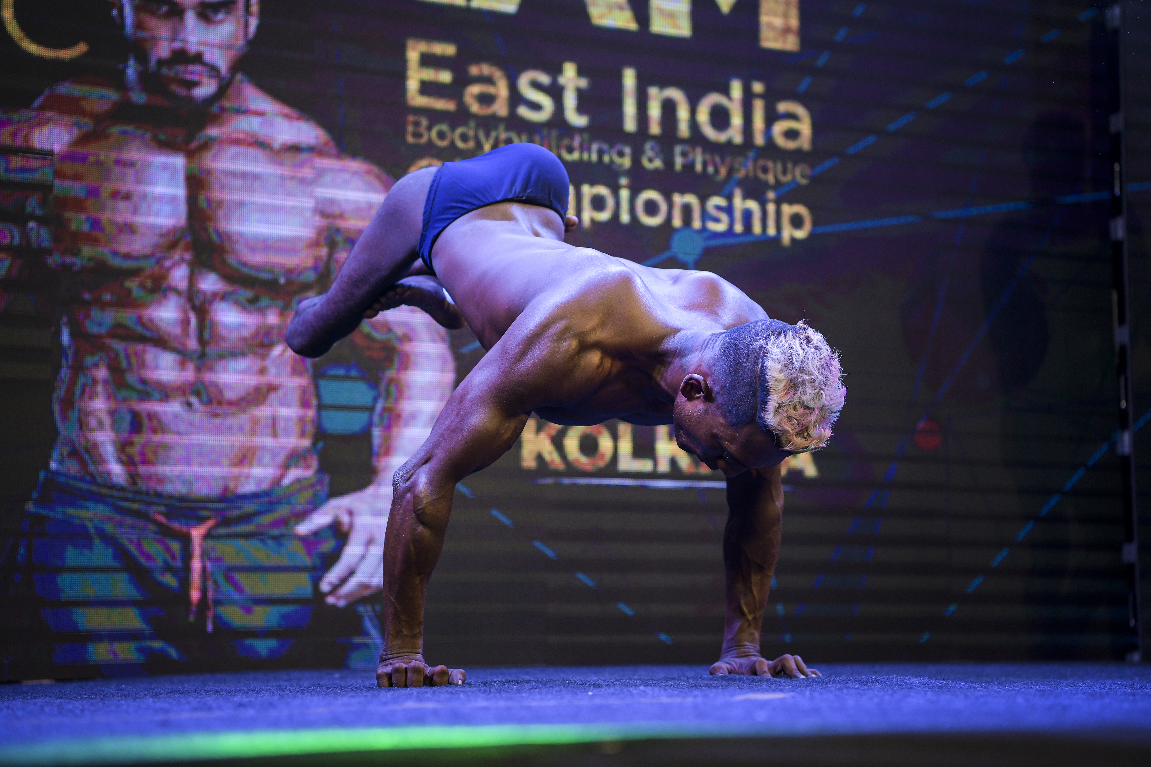 Halder performs a handstand at a local championship