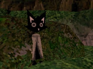 Screenshot from Fetum Betula, a low-poly Cat stands on it's hind legs, wearing a brown tunic. it stands on what seems like a hilly forest floor.