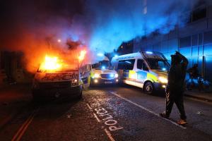 A vandalised police van on fire outside Bridewell Police Station, as other police vehicles arrive after protesters demonstrated against the Government's controversial Police and Crime Bill. Photo: PA Images / Alamy Stock Photo