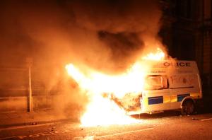 A burning police vehicle during a protest against a new proposed policing bill, in Bristol​, UK. Photo: REUTERS / Alamy Stock Photo