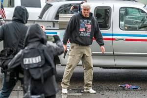 A driver pulls a handgun on protesters after they broke his trucks lights on March 28, 2021 in Salem, Oregon. ​