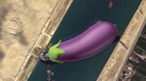 An eggplant emoji on top of the satellite image of the MS Evergiven