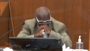 Witness Charles McMillian becomes emotional as he answers questions as Hennepin County Judge Peter Cahill presides Wednesday, March 31, 2021, in the trial of former Minneapolis police Officer Derek Chauvin at the Hennepin County Courthouse in Minneapolis.