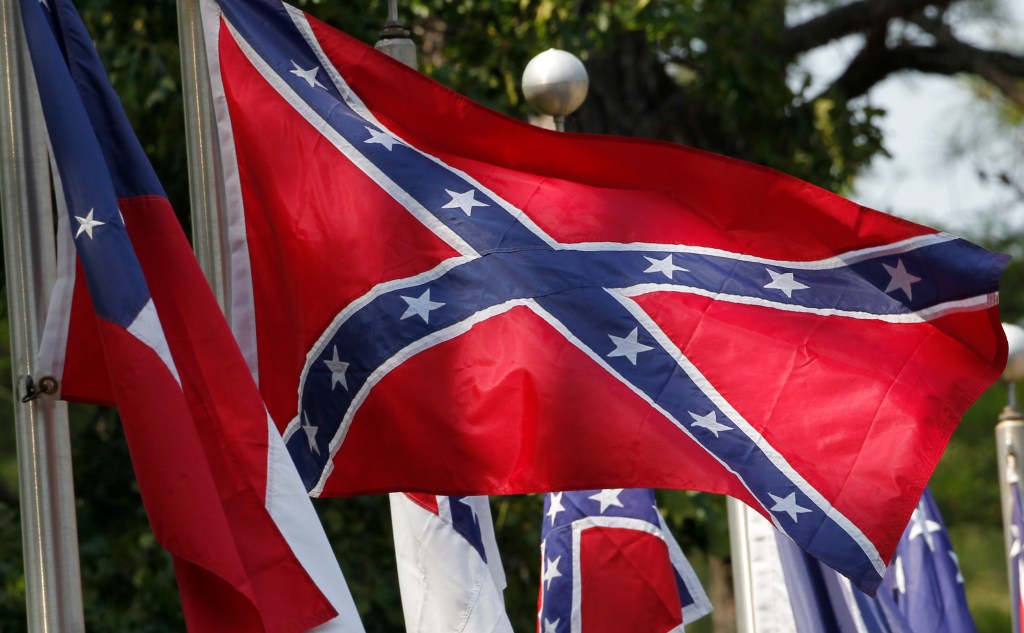 Uthis July 19, 2011, file photo, Confederate battle flags fly outside the museum at the Confederate Memorial Park in Mountain Creek, Ala.