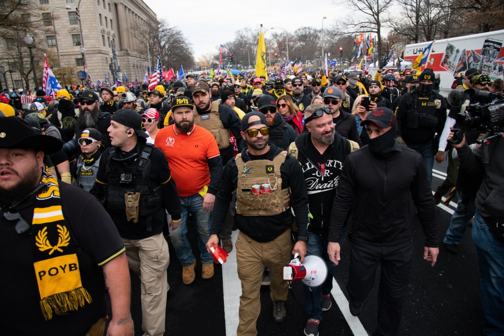 Enrique Tarrio, leader of the Proud Boys, center, and demonstrators wearing Proud Boys attire gather in Freedom Plaza in Washington, D.C., U.S., on Saturday, Dec. 12, 2020.