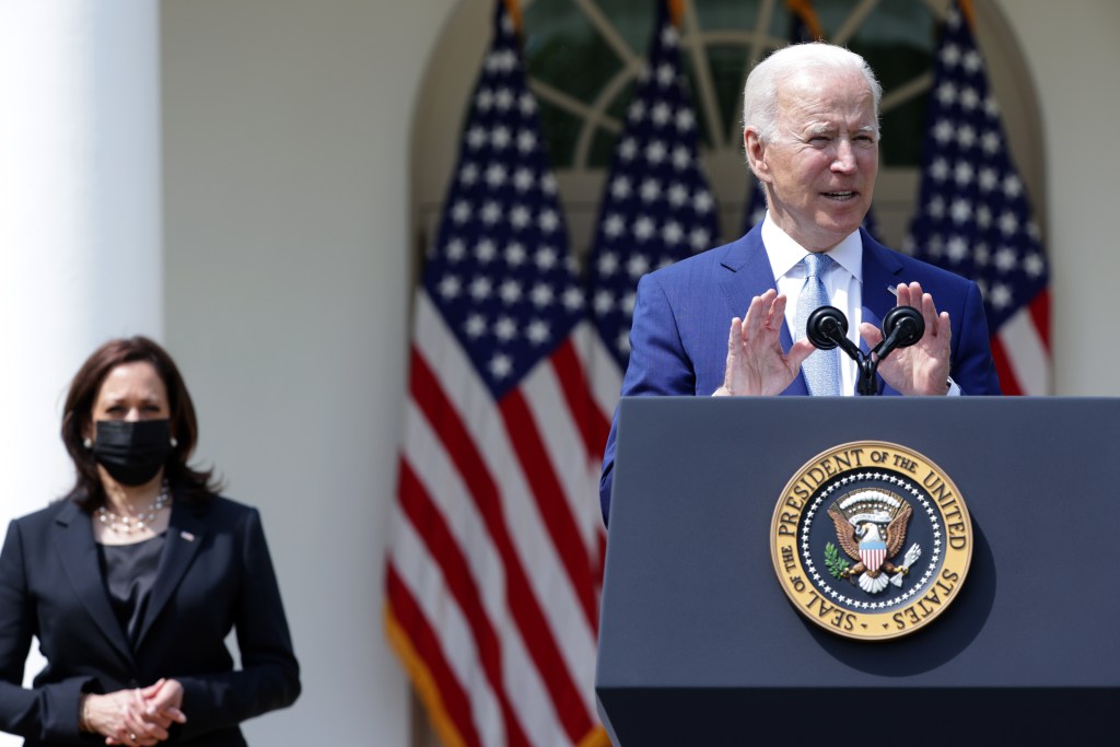 President Joe Biden speaks as Vice President Kamala Harris listens during an event on gun control in the Rose Garden at the White House April 8, 2021 in Washington, DC.