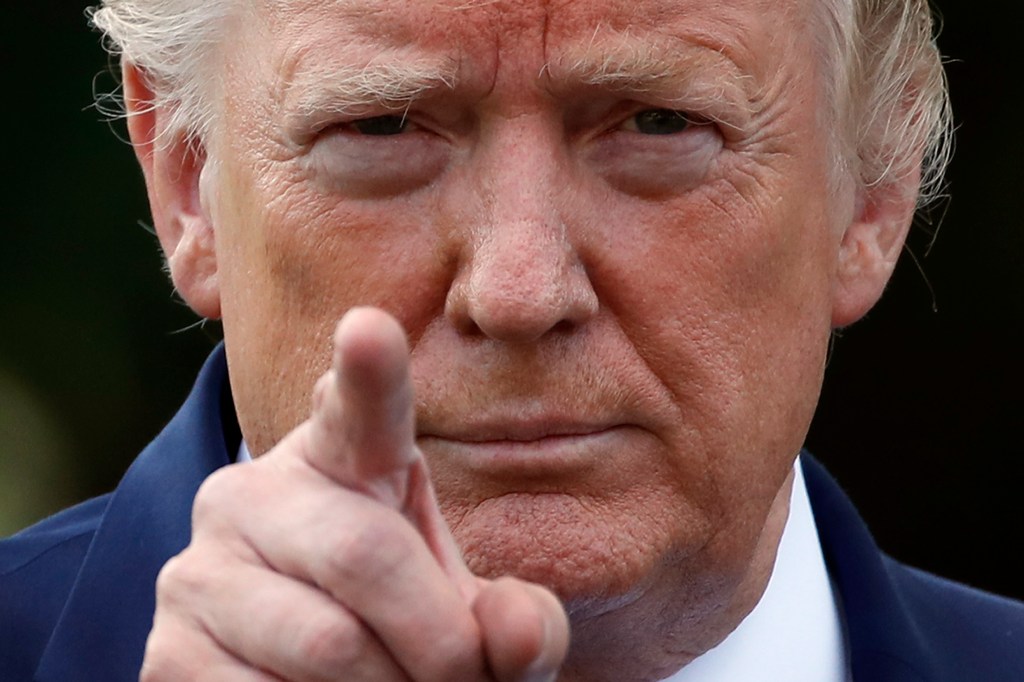 President Donald Trump points to a reporter for a questions as he speaks with reporters on the South Lawn of the White House before departing, Friday, July 19, 2019, in Washington. (AP Photo/Alex Brandon)