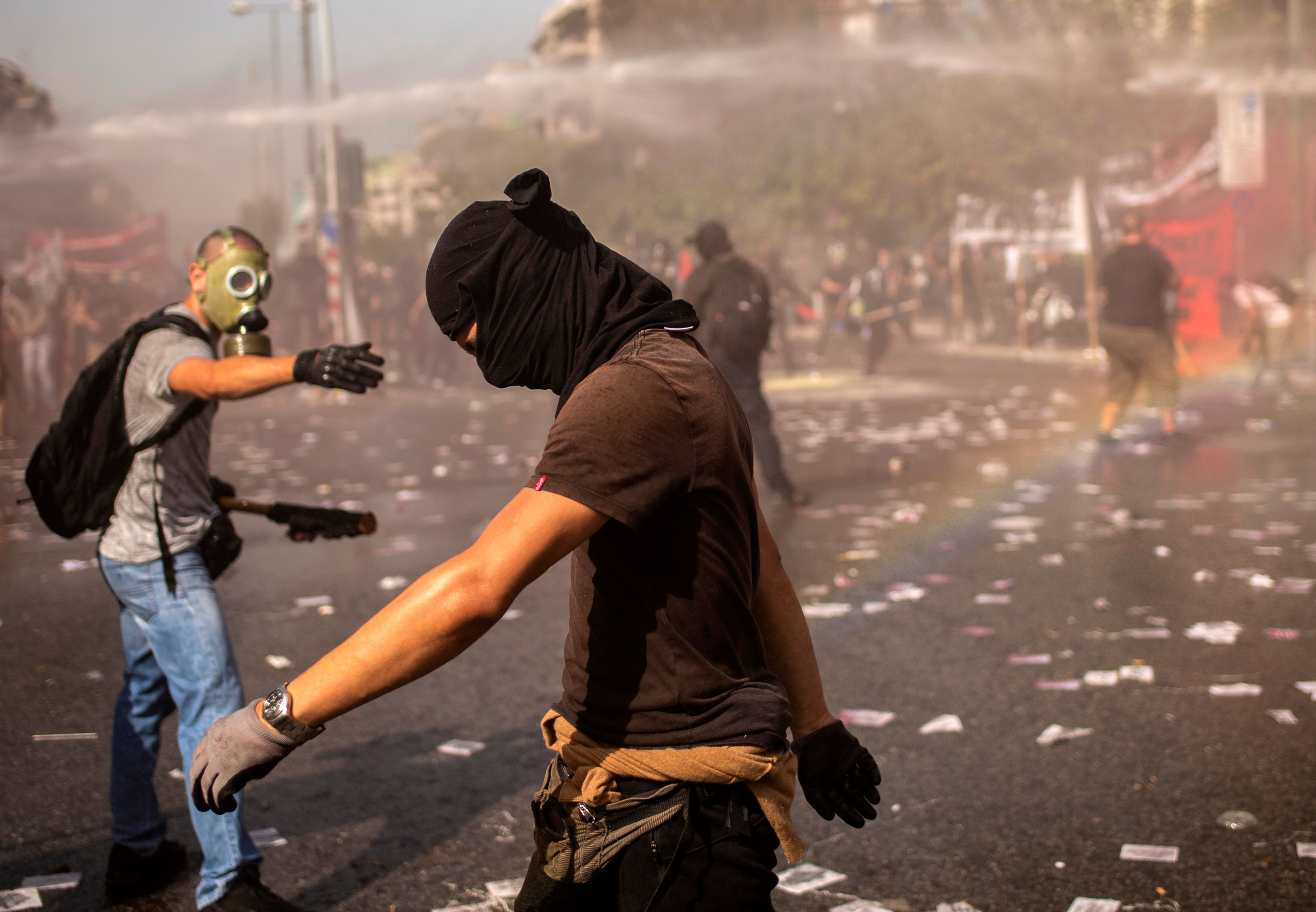 Police deploy water cannons during a protest marking the verdict in the trial of Golden Dawn's leaders in 2020. Photo: ANGELOS TZORTZINIS / AFP) (Photo by ANGELOS TZORTZINIS/AFP via Getty Images