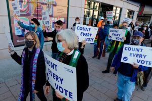 Protestors who want every vote counted from the 2020 presidential election, march down Woodward Avenue on November 4, 2020 in Detroit, Michigan.​