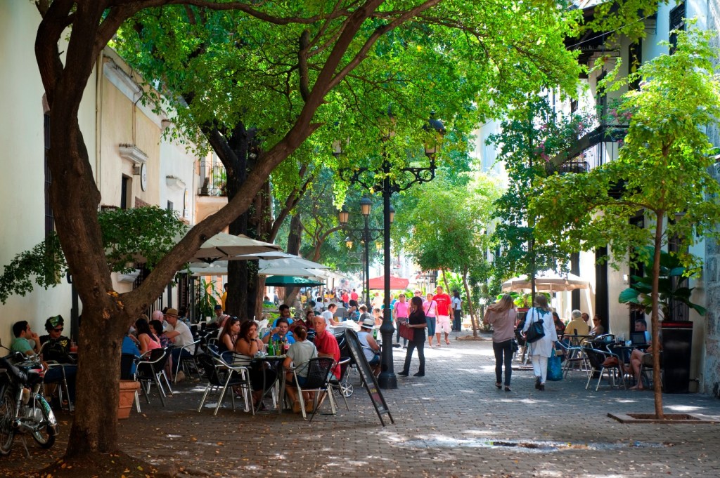 Bars in the heart of Santa Domingo in the Dominican Republic. Other illegal establishments have been shut down after people died from consuming illicit alcohol.