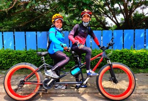 A couple on a tandem bike