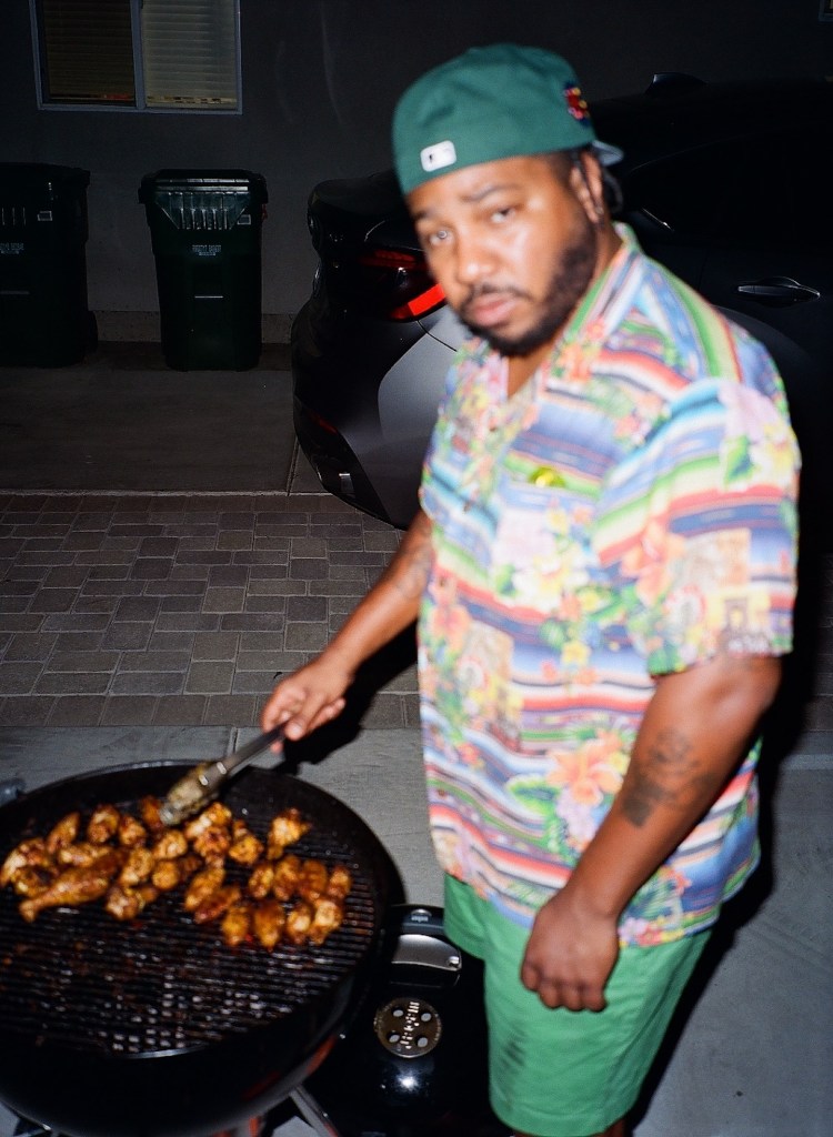 Chuck Inglish cooking on barbecue