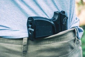 GettyImages-Man with a handgun in the back of his pants (iStock/Getty Images)​