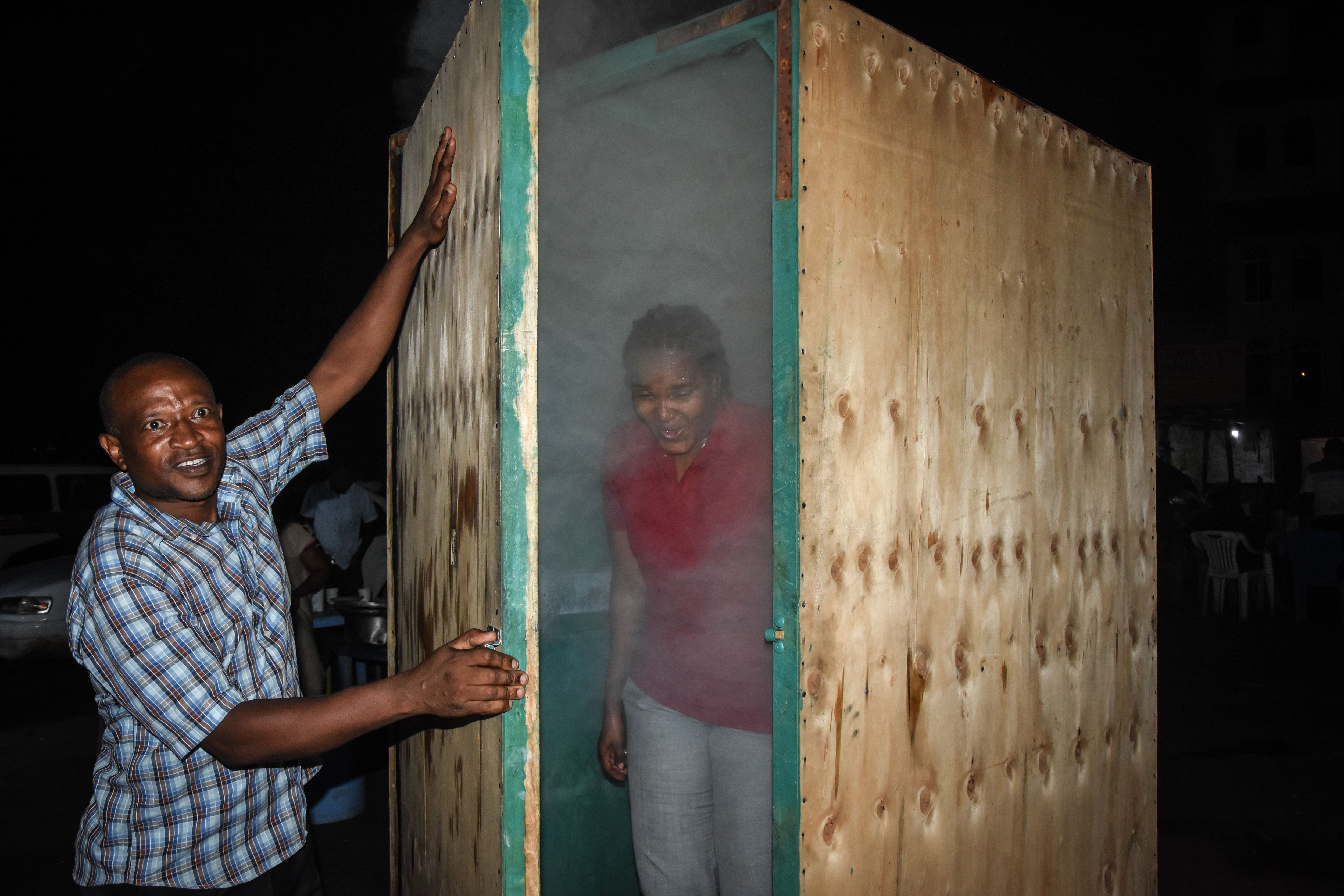 A woman leaves a steam inhalation booth in Das es Salaam. Photo: ERICKY BONIPHACE/AFP via Getty Images