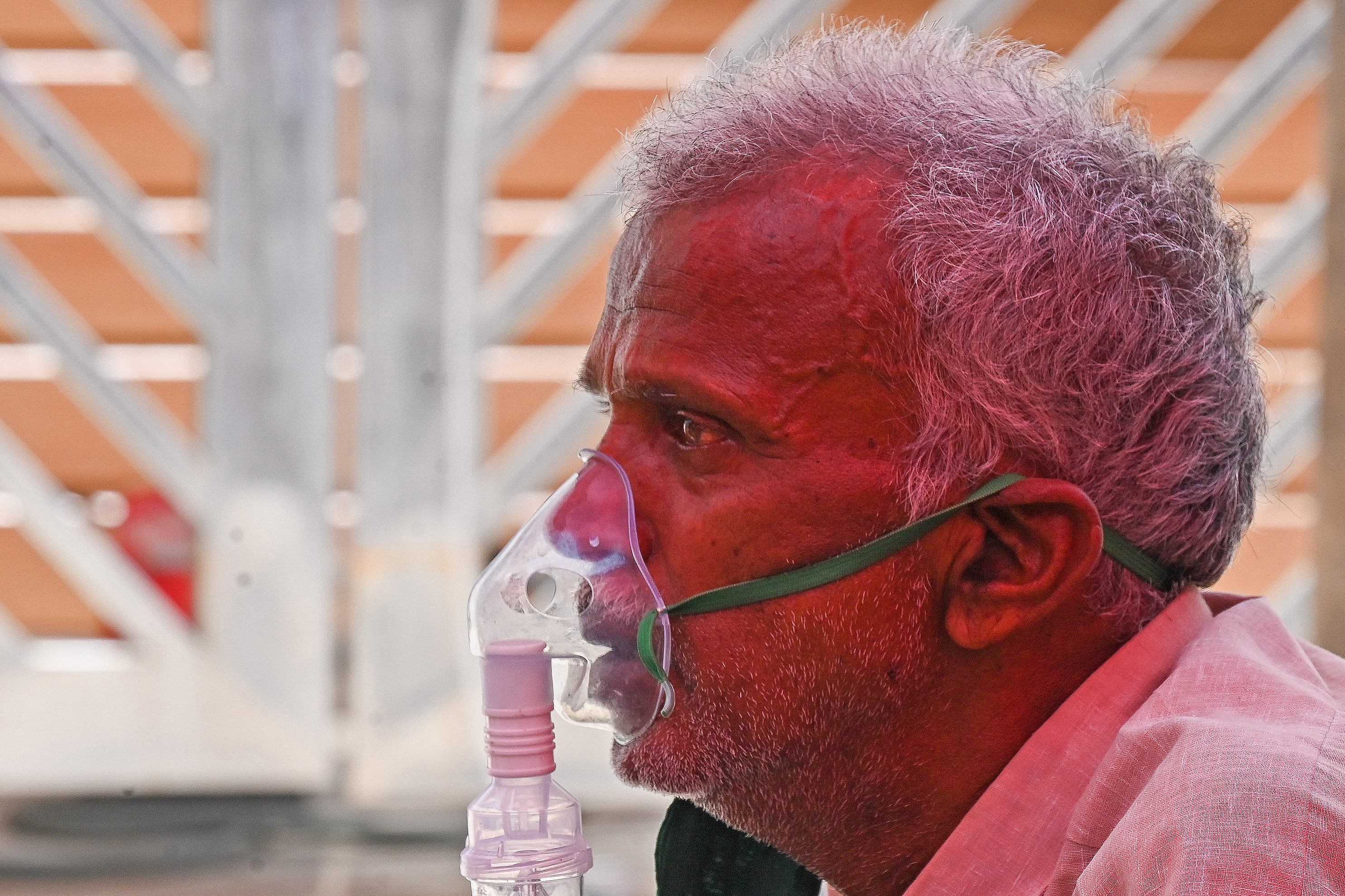 A coronavirus patient breathes with the help of oxygen. PHOTO: Prakash SINGH / AFP