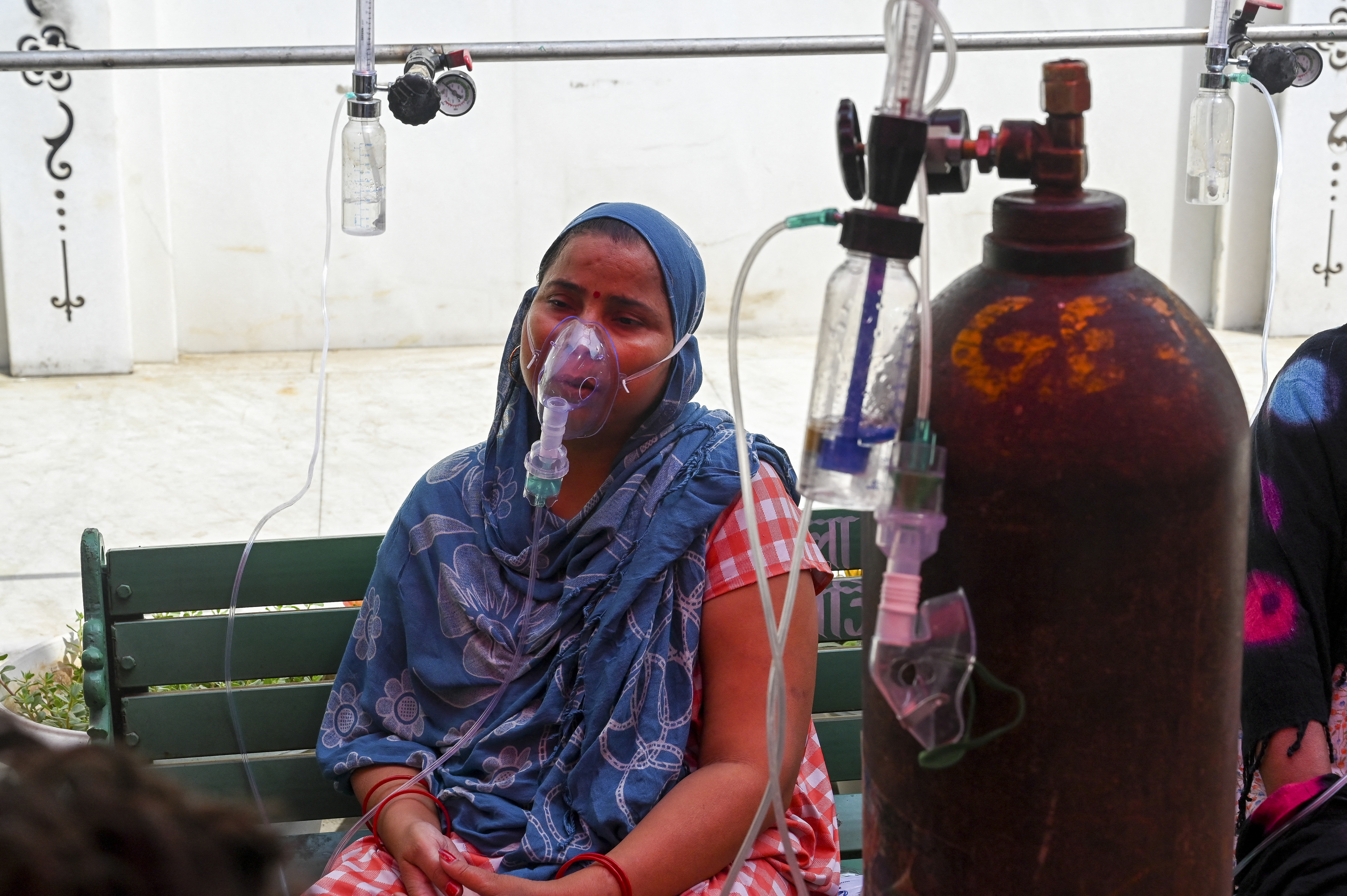 A coronavirus patient breathes with the help of oxygen. PHOTO: Prakash SINGH / AFP