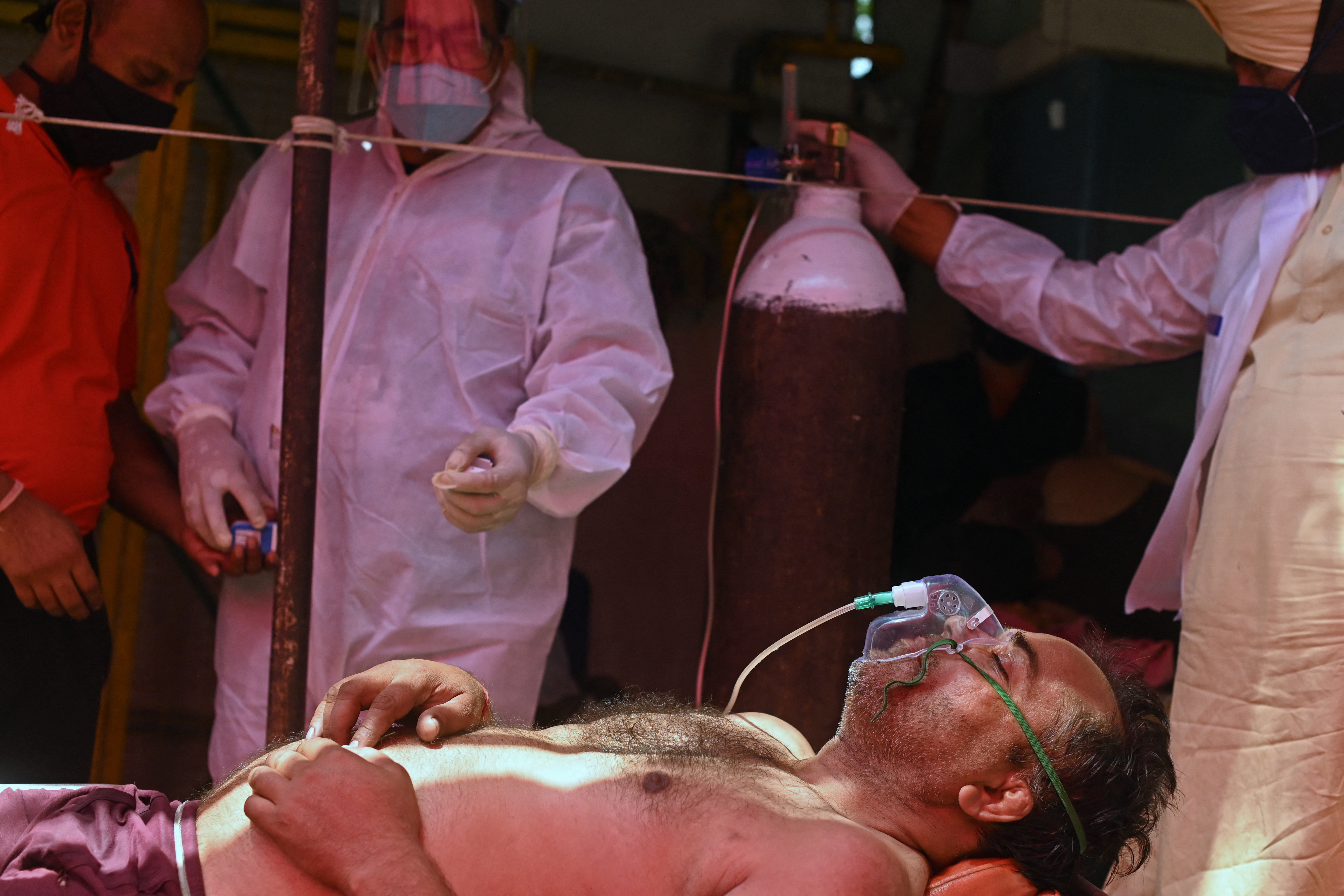 A patient breathes with the help of oxygen. PHOTO: Sajjad HUSSAIN / AFP