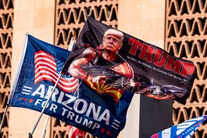 Supporters of US President Donald Trump hold flags as they demonstrate in front of the Arizona State Capitol in Phoenix, Arizona, on November 7, 2020. (Photo: OLIVIER TOURON/AFP via Getty Images)