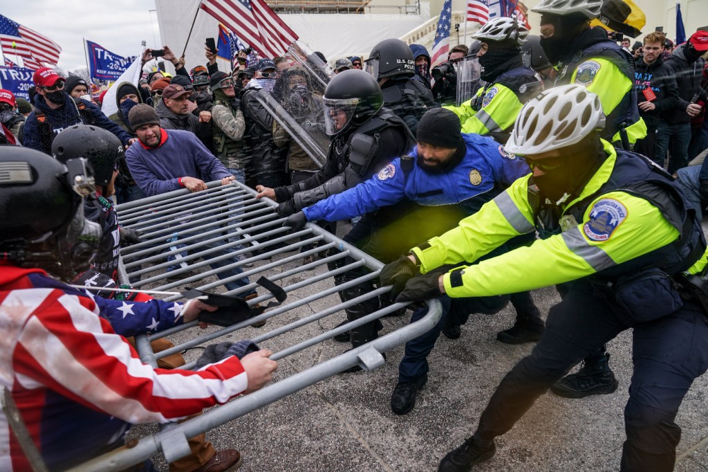 In this Jan. 6, 2021, file photo, Trump supporters try to break through a police barrier at the Capitol in Washington. (AP Photo/John Minchillo, File)