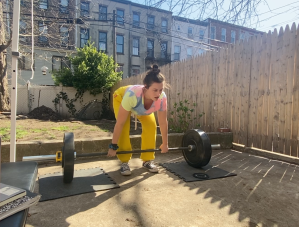 a woman deadlifting 135 pounds