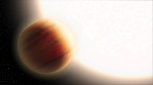 This is an artist's illustration of the super-hot exoplanet WASP-79b, located 780 light-years away. The planet orbits precariously close to a star that is much hotter than our Sun. The planet is larger than Jupiter, and its very deep, hazy atmosphere sizz