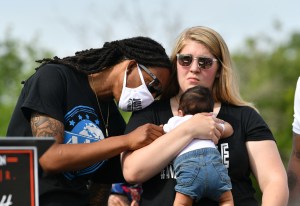 Khalil Ferebee, the son of Andrew Brown, Jr., looks on at Andrew's grandson Karter Ferebee after his grandfather was killed on May 02, 2021 in Elizabeth City, North Carolina.