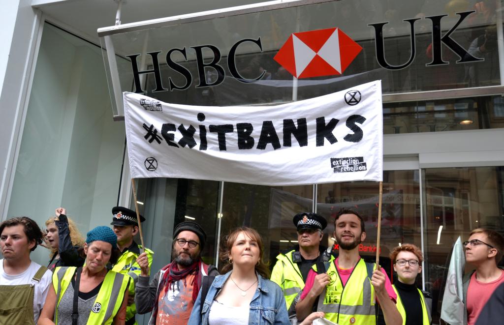 Extinction Rebellion campaigners protest outside an HSBC bank in Manchester, northern England, in 2019. Photo: Andy Barton/Alamy Live News