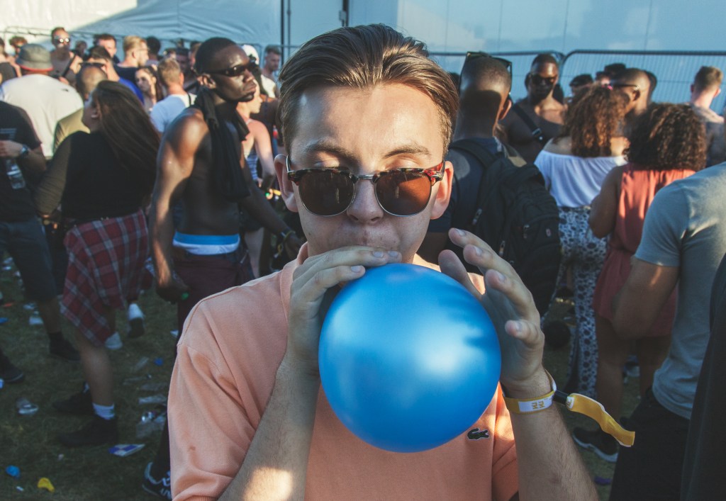 Person with balloon at music festival