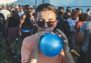 Person with balloon at music festival