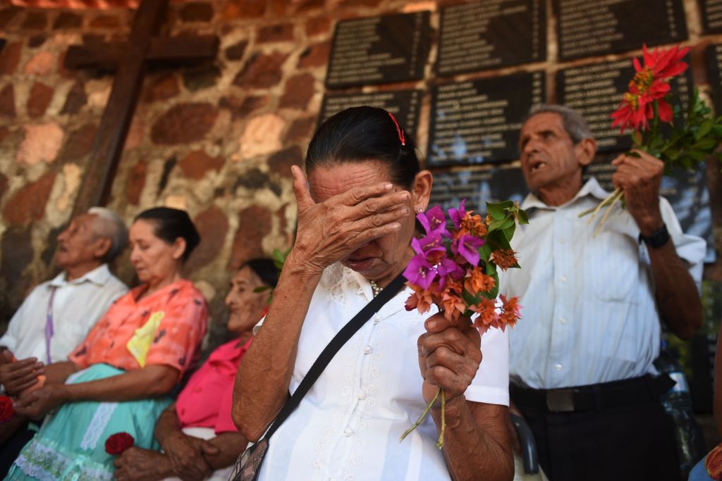 People participate in events held to commemorate the 1981 massacre in El Mozote, 200 km east of San Salvador, on December 9, 2016