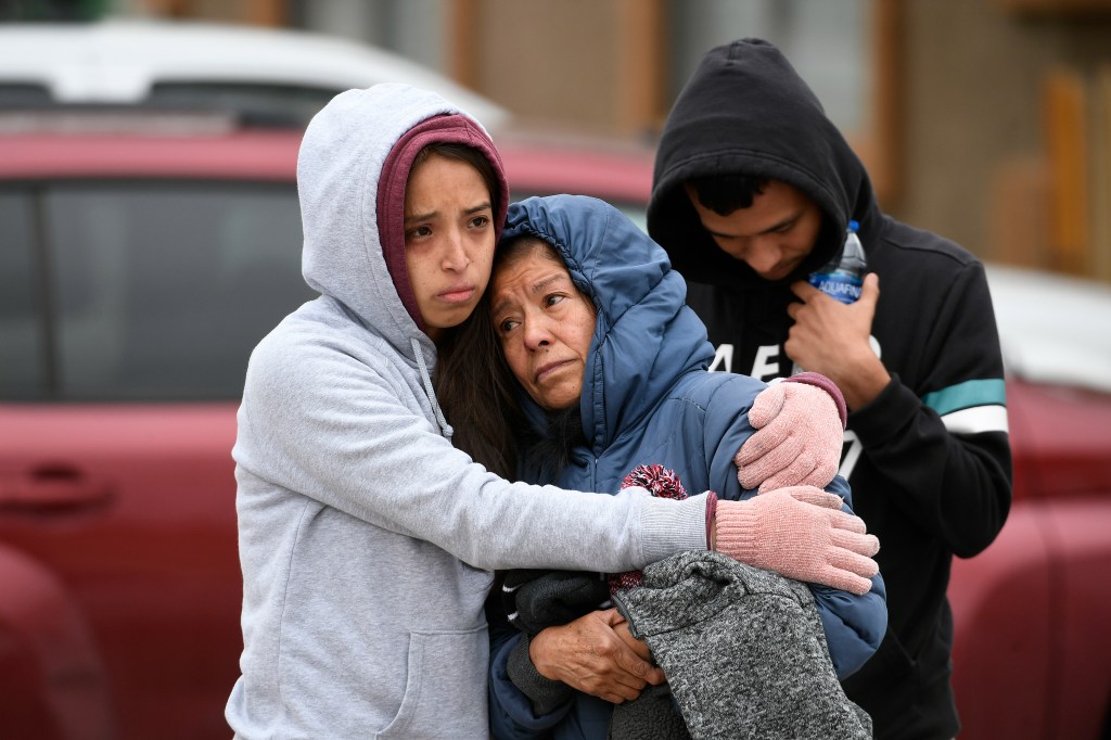 Family members of some of the six shooting victims hug one another outside the scene of the shooting at the Canterbury Mobile Home Park on May 9, 2021 in Colorado Springs, Colorado (Photo by Helen H. Richardson/MediaNews Group/The Denver Post via Getty Im