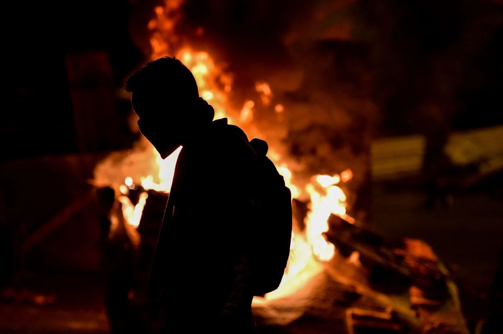 A demonstrator at a barricade blocking a street during a protest against the government in Cali, Colombia, on May 10, 2021.