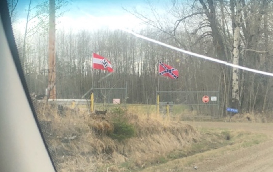 According to police, the owner of the Hitler Youth and Confederate flags has not taken them down.