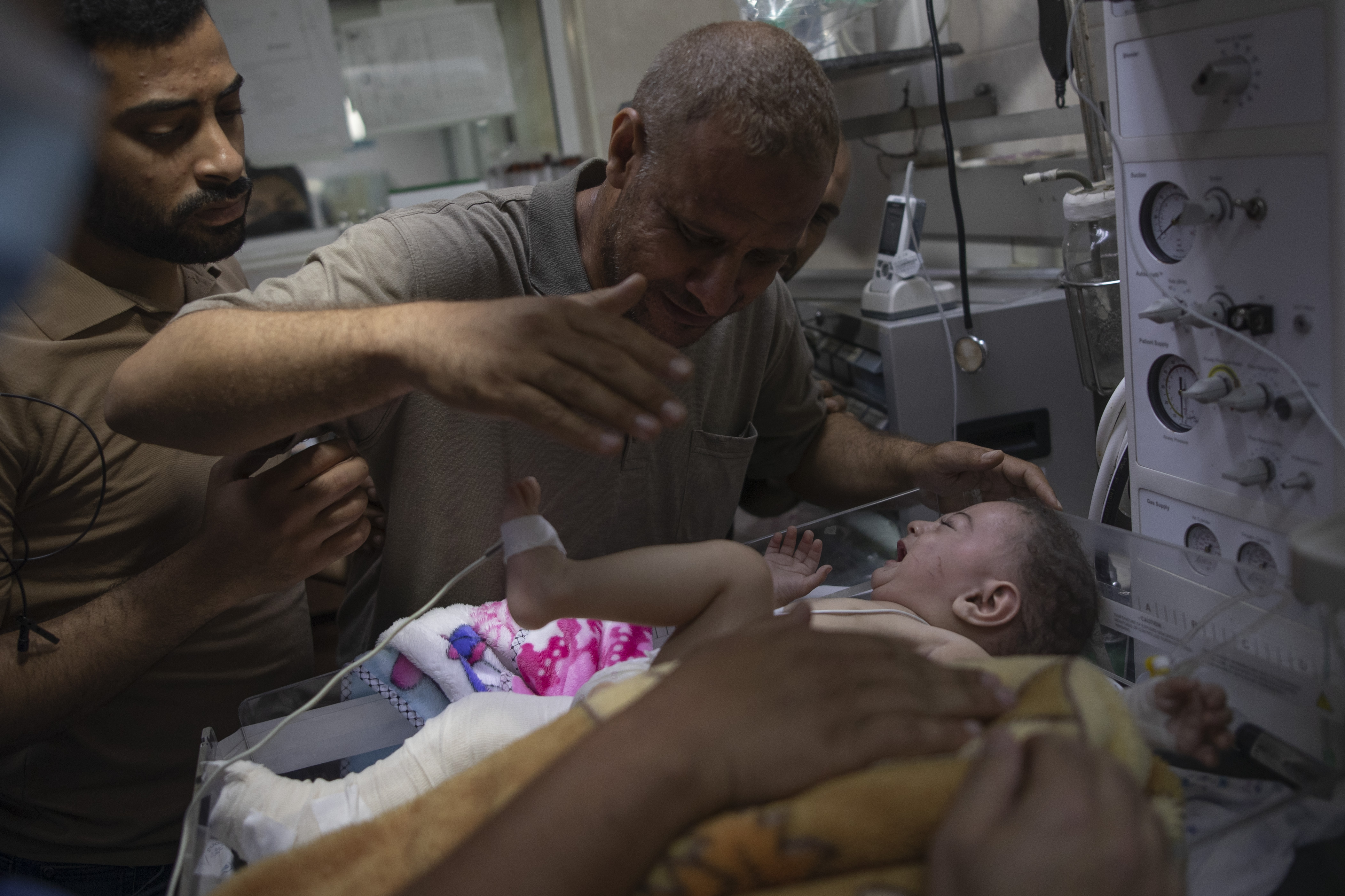 Five-month-old Omer Hadidi, who lost his mother and siblings in an Israeli airstrike upon the Shati Refugee Camp, is treated at Shifa Hospital in Gaza City. Photo: Ali Jadallah/Anadolu Agency via Getty Images