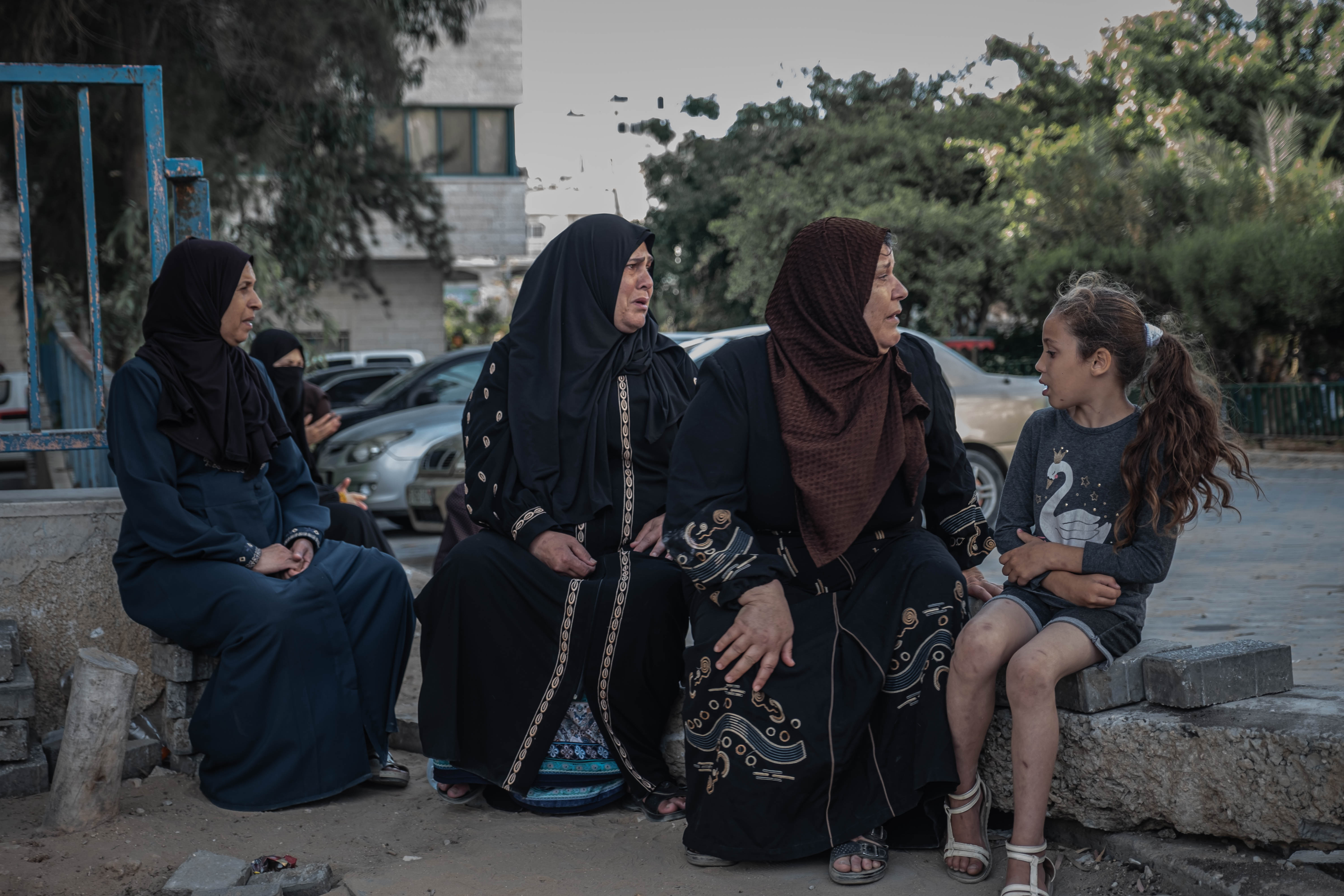 Women await the arrival of the bodies of their relatives who were killed in an Israeli airstrike in Gaza City. Photo: Fatima Shbair/Getty Images