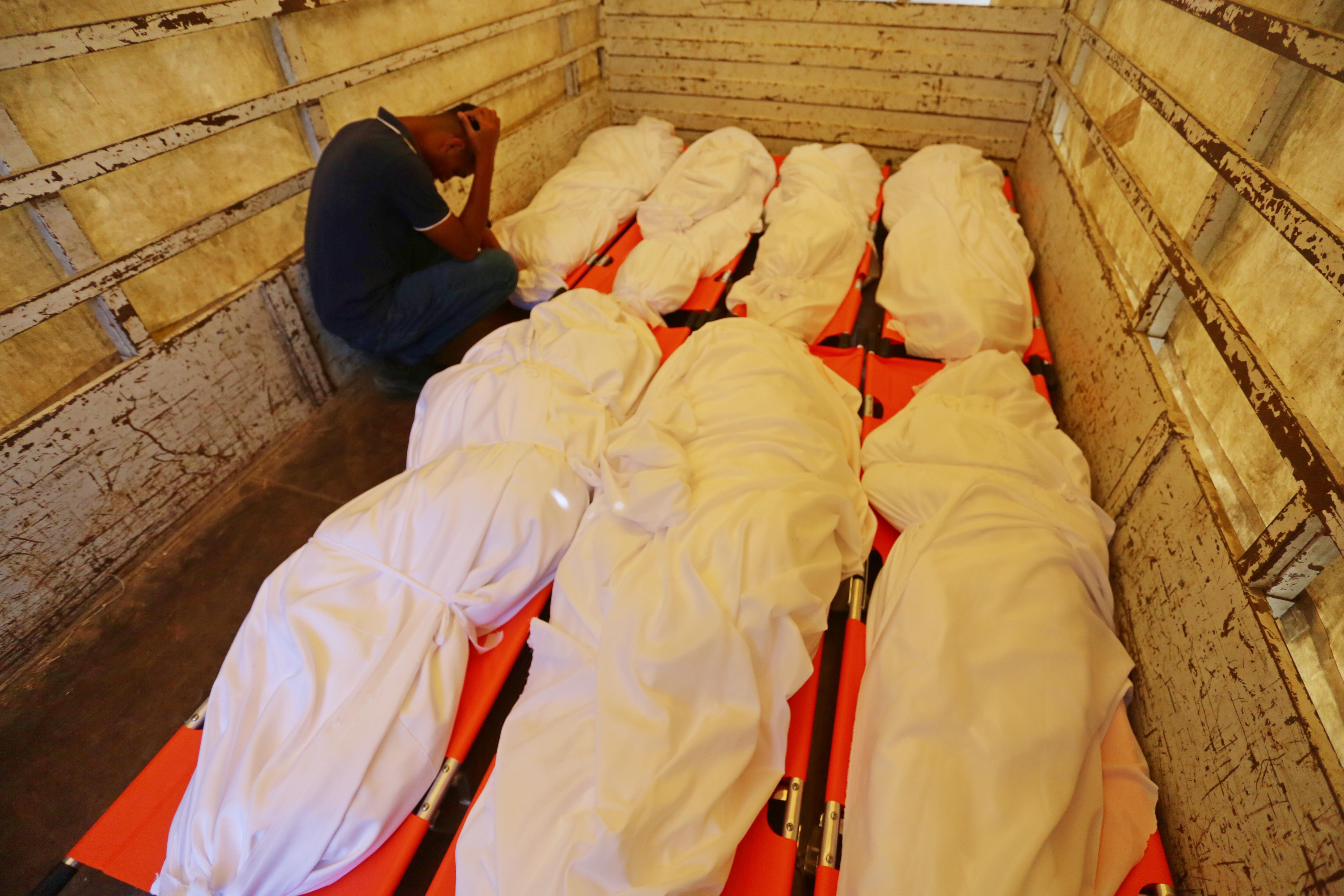 Bodies are transported to the morgue after airstrikes hit buildings in the al-Rimal neighbourhood of Gaza City. Photo: Ashraf Amra/Anadolu Agency via Getty Images