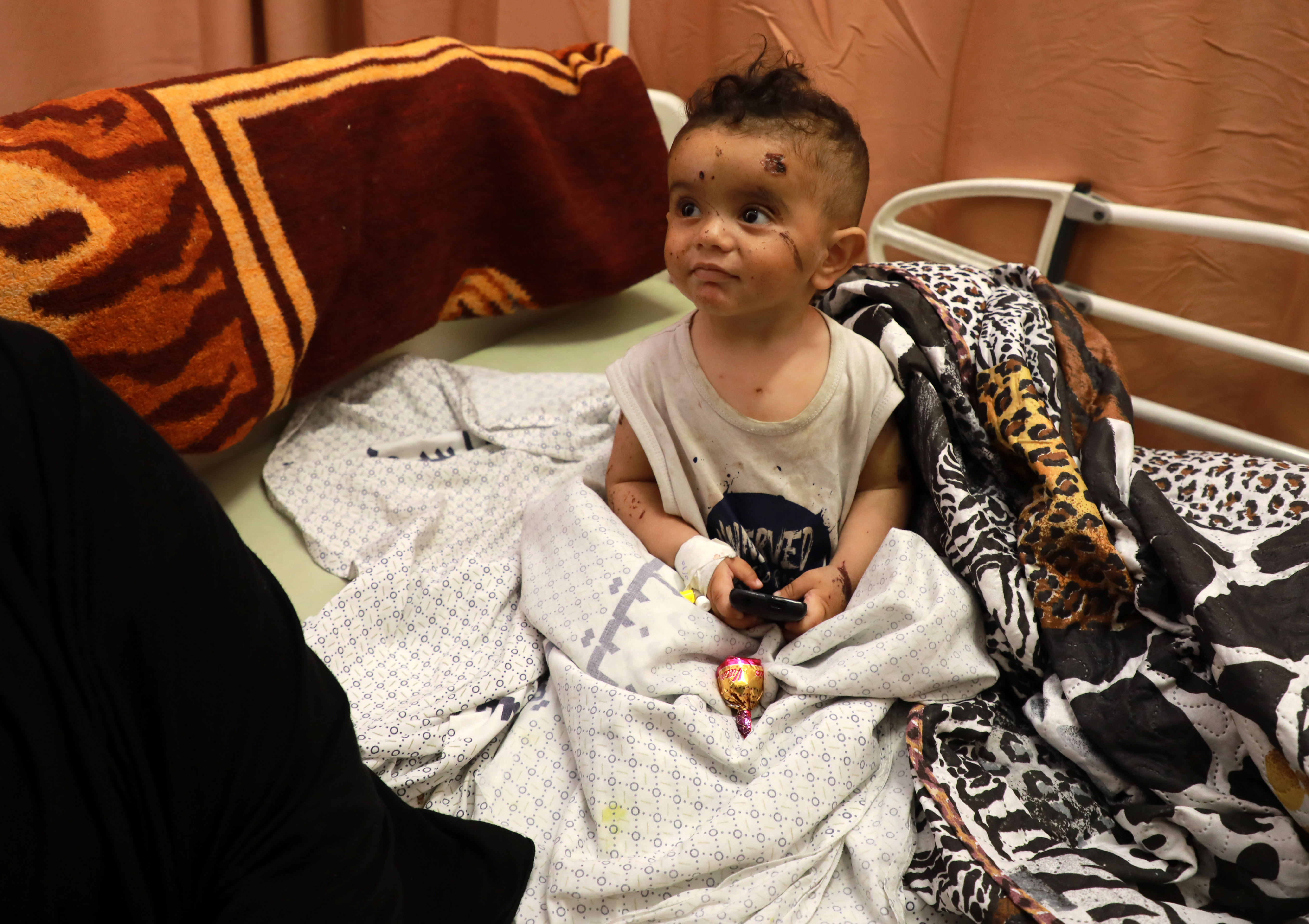 A Palestinian child receives treatment in hospital after being wounded in an overnight airstrike. Photo: Majdi Fathi/NurPhoto via Getty Images