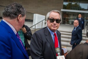 Attorneys L. Lin Wood (C) and Mark Stephen (L) speak to the media about their client, British rescue diver Vernon Unsworth (rear), as they arrive at US District Court on December 3, 2019 in Los Angeles, California.(Photo by Apu Gomes/Getty Images)