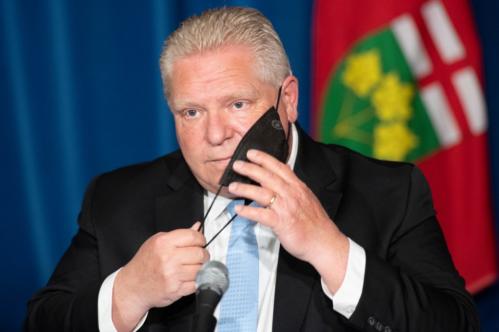 Ontario Premier Doug Ford reacts to a question during a press conference at the Ontario Legislature in Toronto, Thursday, May 13, 2021.